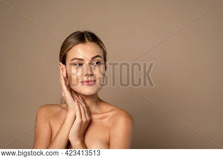 Skin Care. Woman With Beauty Face Touching Healthy Facial Skin. Beautiful Smiling Caucasian Female M