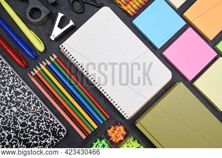 School Supplies: Top view still life on white of asorted school supplies with copy space.