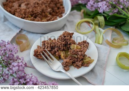 Sweet Home Made Chocolate Rhubarb Crumble With Lilach Flowers