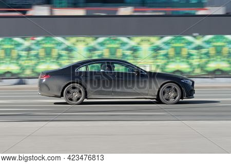 Moscow , Russia - March 2021: Fast Moving Mercedes-benz Cls-class Sedan C257 Rides On City Road. Sid