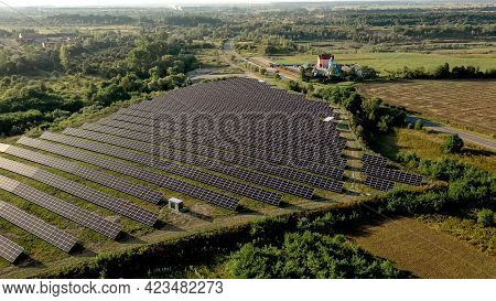 Solar Panels In Aerial View. Power Farm Producing Clean Energy.