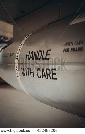 Duxford England May 2021 Close Up View Of A Bomb On A Usa Fighter Jet , Text Saying Handle With Care