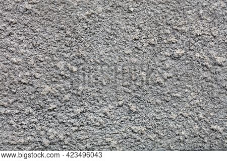 Texture And Background Of Gray Facade Plaster With Large Cement Granules.