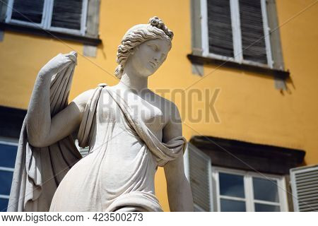San Salvatore Square In Lucca (tuscany, Italy), Detail Of The Ancient Fountain Statue Of Venus With 
