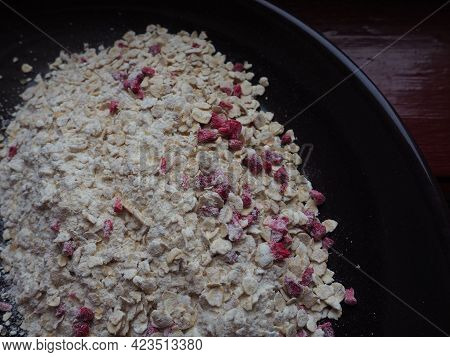Organic Granola Cereal With Oats, Powdered Sugar And Dry Raspberries. Healthy Muesli As A Dry Mix. A