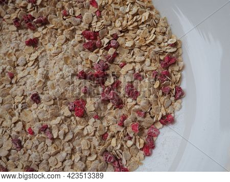 Organic Granola Cereal With Oats, Powdered Sugar And Dry Raspberries. Healthy Muesli As A Dry Mix. A