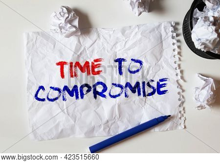 Text Time To Compromise Written On Notepad With Calculator, Pensil, Magnifier And Dollars. Business 