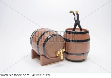 The Scale Of Wasiter Figure On Wooden Wine Barrel