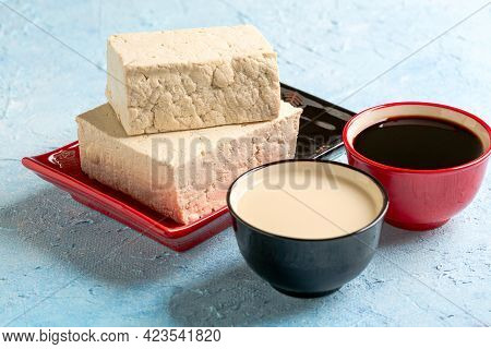 Fresh Soy Curd (tofu), Soy Milk And Sauce In Ceramic Bowls. Concept Eat Less Meat, Plant-based And H