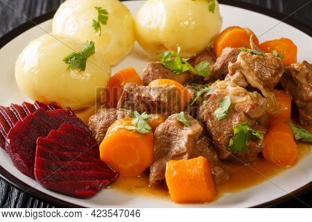 Swedish Beef Stew Kalops Slow Simmered With Vegetables Close Up In The Plate On The Table. Horizonta