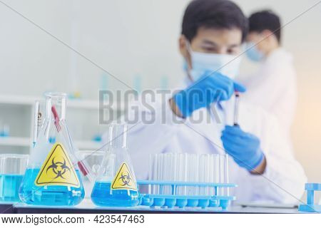 Two Asian Scientist Team Reserch Chemistry Science Tube Experiment Biotech Antibody Sample In Labora