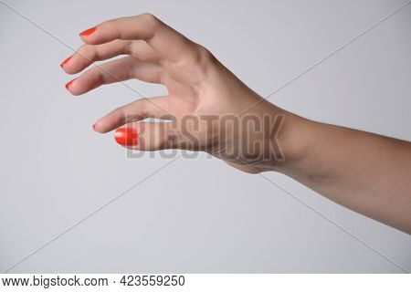 Hand Of A Girl Trying To Reach Or Grab Something. Fling, Touch Sign. Isolated On White Background.