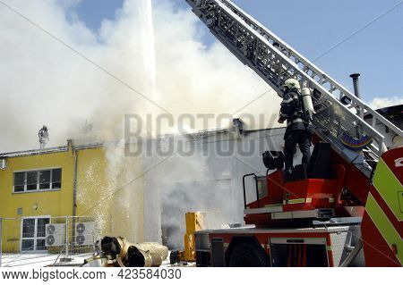 Fire Department Emergency Response With A Turntable Ladder