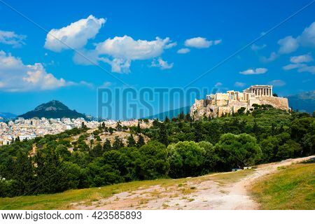 Famous greek tourist landmark - the iconic Parthenon Temple at the Acropolis of Athens as seen from Philopappos Hill, Athens, Greece