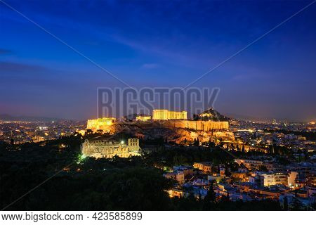 Famous greek tourist landmark - the iconic Parthenon Temple at the Acropolis of Athens as seen from Philopappos Hill in the evening blue hour, Athens, Greece
