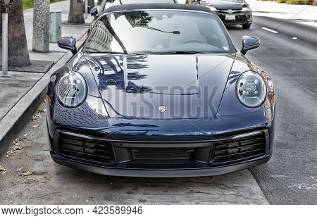 Long Beach, California Usa - April 11, 2021: Dark Blue Porsche 911 Carrera Cabriolet. Front View.