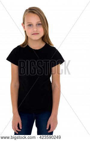 Pretty Blonde In A Black T-shirt. Girl In Fashionable Clothes Posing In The Studio. Close Up Portrai