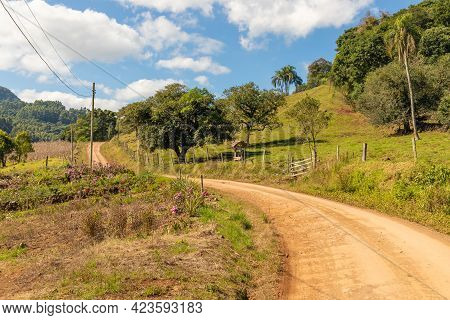 Dirty Road With Farm Field And Small Garden Around, Pinhal Alto, Nova Petropolis, Rio Grande Do Sul,