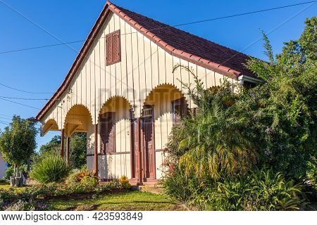 Old Wood House With Colorful Garden