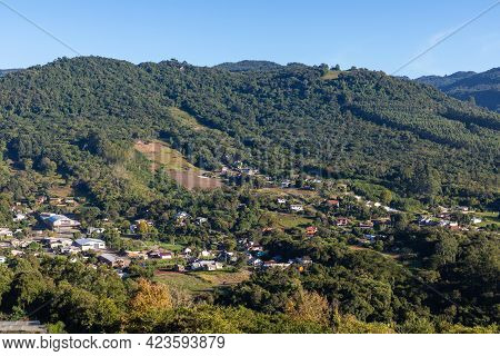 Village Around Forest And Mountains