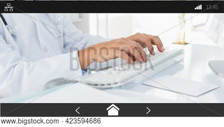 Composition of male doctor using computer on digital image interface screen. medical and healthcare services communication digital interface concept digitally generated image.