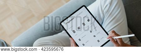 Woman using a stylus with a digital tablet mockup during coronavirus quarantine at home