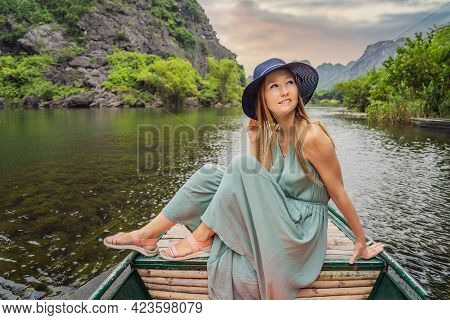 Woman Tourist In Trang An Scenic Landscape Complex In Ninh Binh Province, Vietnam A Unesco World Her