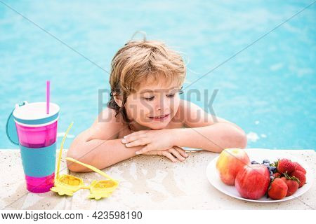 Little Boy With Fresh Cocktail And Fruits On Watter Pool In The Summer Day. Kid In Swimming Pool Rel