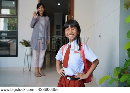 Beautiful Asian Primary Student Going To School In The Morning