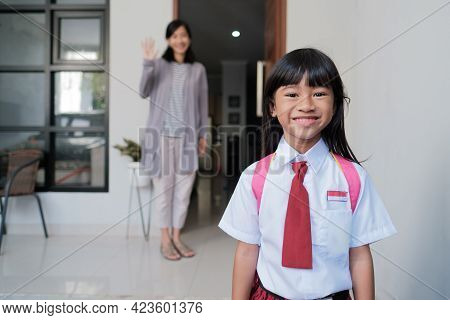 Back To School. Asian Pupil With Primary Student Uniform Getting Ready To School
