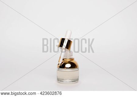 Transparent Golden Bottle With Pipette And Hylauronic Acid. Top Horizontal View Copyspace