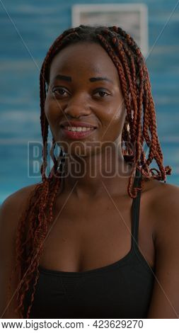 Portrait Of Black Woman Smiling And Looking Into Camera During Fitness Morning Workout Sitting On Yo