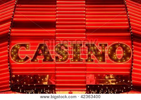 Casino entrance sign in red neon lights