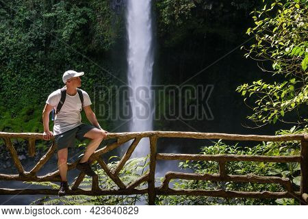 Tourist At The La Fortuna Waterfall In Costa Rica