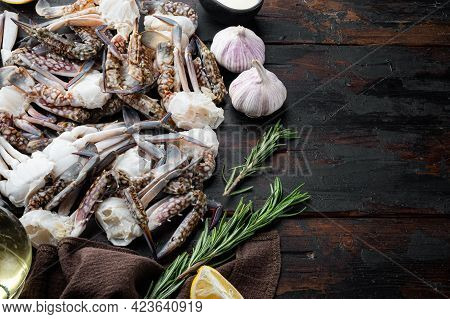 Fresh Raw Blue Swimming Crab Ocean Gourme Parts Set, On Dark Wooden Background , With Copyspace  And