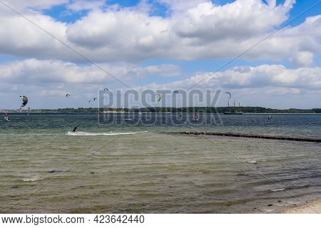 Lots Of Kite Surfing Activity At The Baltic Sea Beach Of Laboe In Germany On A Sunny Day