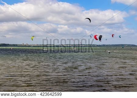 Lots Of Kite Surfing Activity At The Baltic Sea Beach Of Laboe In Germany On A Sunny Day