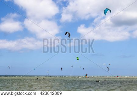 Lots Of Kite Surfing Activity At The Baltic Sea Beach Of Laboe In Germany On A Sunny Day