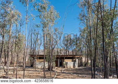 Seweweekspoort, South Africa - April 6, 2021: Ablution Building Between Trees At Op Die Plaas Campin