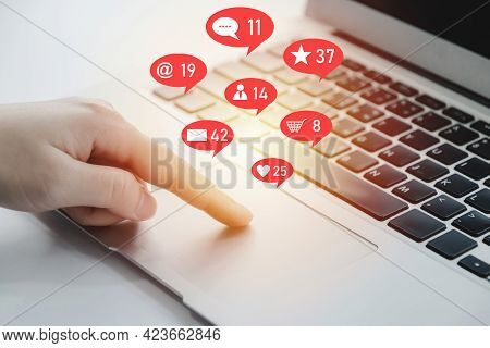 Businesswoman Hand Working On Digital Laptop Computer With Social Network Icon On Desk At Home Offic