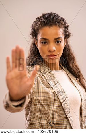 Studio Shot Portrait Of Angry And Authoritative African-american Ethnicity Businesswoman.