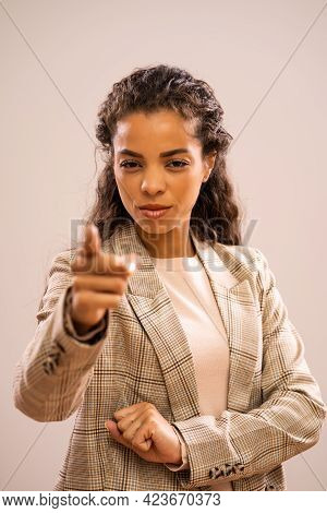 Studio Shot Portrait Of Angry And Authoritative African-american Ethnicity Businesswoman.