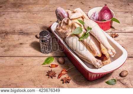 Raw Whole Chicken Carcass For Healthy Food Lifestyle With Traditional Chinese Spices In Ceramic Baki