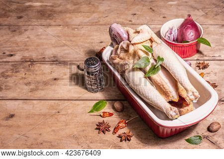 Raw Whole Chicken Carcass For Healthy Food Lifestyle With Traditional Chinese Spices In Ceramic Baki