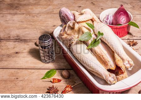 Raw Whole Chicken Carcass For Healthy Food Lifestyle With Traditional Chinese Spices In Ceramic Baki