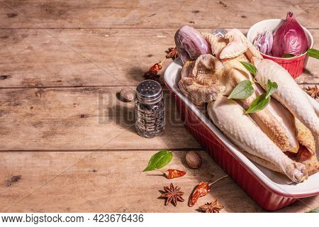 Raw Whole Chicken Carcass For Healthy Food Lifestyle With Traditional Chinese Spices In Ceramic Baki