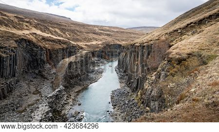 Studlagil Basalt Canyon, Iceland. This Is A Rare Volcanic Basalt Column Formation
