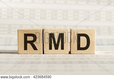 Rmd Abbreviation - Required Minimum Distributions, On Wooden Cubes On A Light Background.