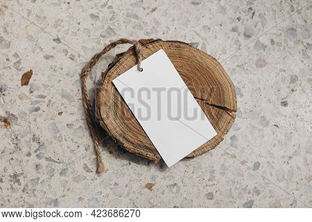 Paper Gift Tag, Price Label With String Of Sisal Trope On Round Wooden Board, Coaster. Terazzo Table