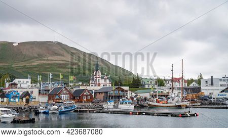 Husavik, Iceland - June 2019: Townscape Of Husavik, With Traditional Old Wooden Fisherman Boats Used